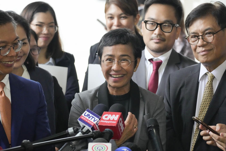 Filipino journalist Maria Ressa, 2021 Nobel Peace Prize winner and Rappler CEO, gestures as she talks to reporters after being acquitted by the Pasig Regional Trial Court over a tax evasion case in Pasig city, Philippines on Tuesday, Sept. 12, 2023. (AP Photo/Aaron Favila)