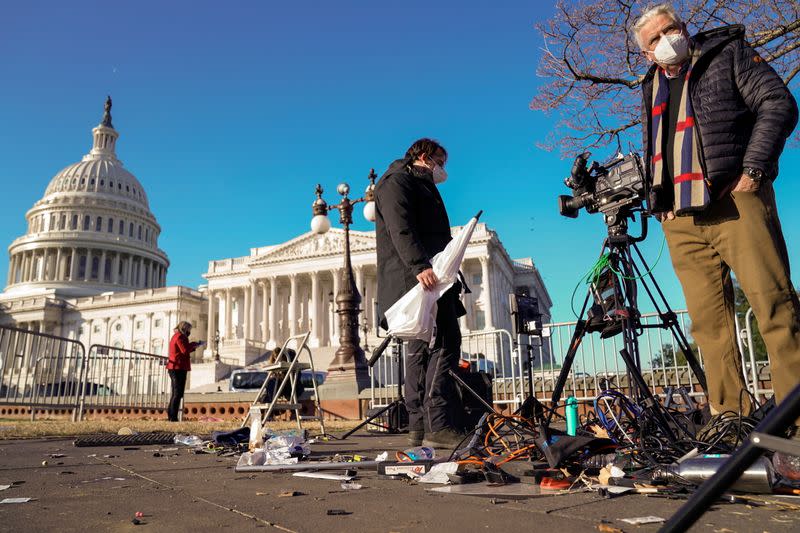 Members of the news media return to the U.S. Capitol in Washington