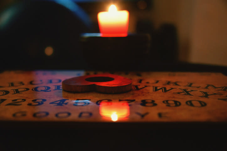 A candle and a Ouija board