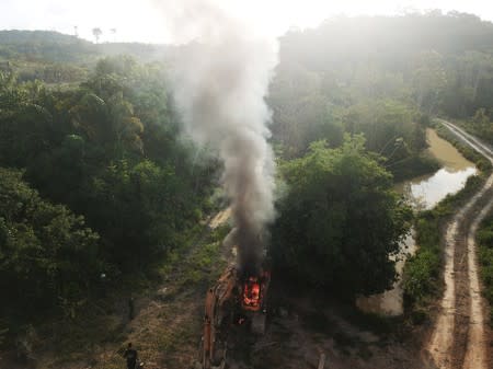 An aerial view shows machines being destroyed during an operation conducted by the Brazilian Institute for the Environment and Renewable Natural Resources (IBAMA) and Federal Police at an illegal gold mine near the city of Altamira