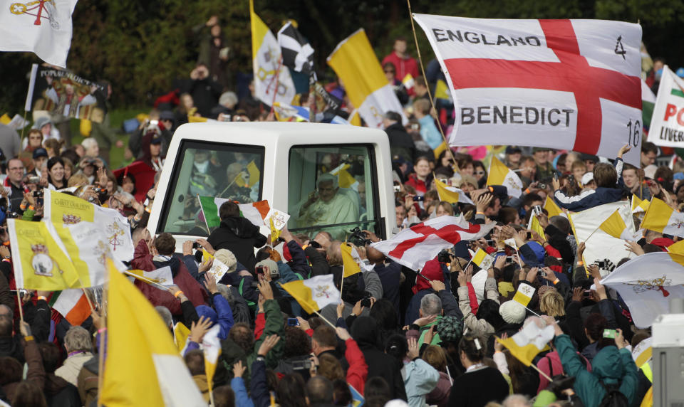 FILE - Pope Benedict XVI is cheered by faithful upon his arrival in Cofton park to celebrate a beatification mass for Cardinal John Henry Newman in Birmingham, England, on Sept. 19, 2010. Pope Emeritus Benedict XVI, the German theologian who will be remembered as the first pope in 600 years to resign, has died, the Vatican announced Saturday. He was 95. (AP Photo/Gregorio Borgia, File)