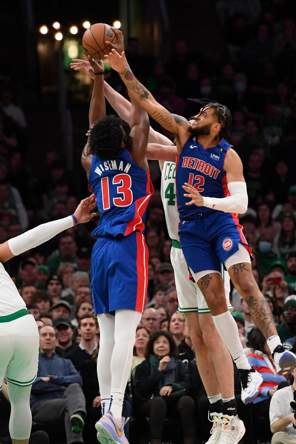 Detroit Pistons center James Wiseman and forward Isaiah Livers battle the Boston Celtics for the ball during the first half at TD Garden  in Boston, Feb. 15, 2023.