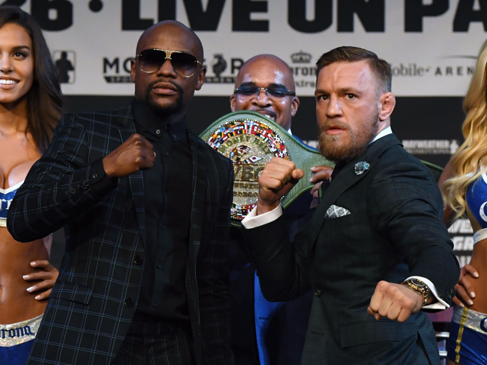 Mayweather McGregor face off with belt