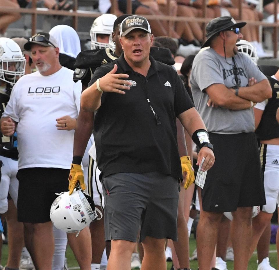 Rider's Head Coach Marc Bindel talks to one of his players during a scrimmage against Frenship on Friday, August 18, 2023 at Memorial Stadium.