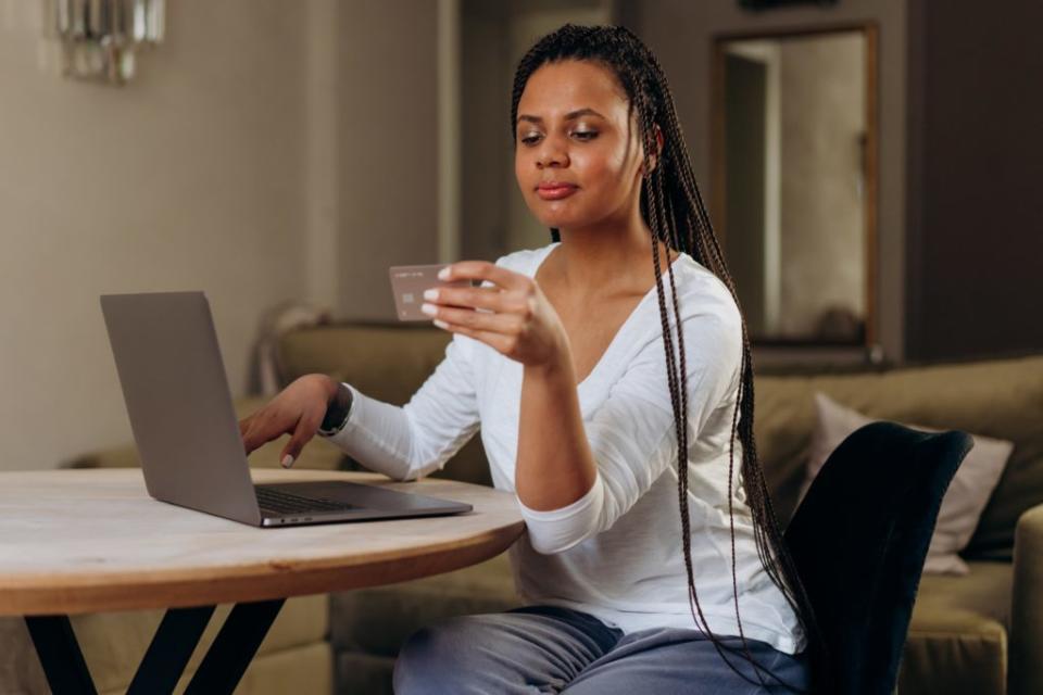 Woman holding credit card