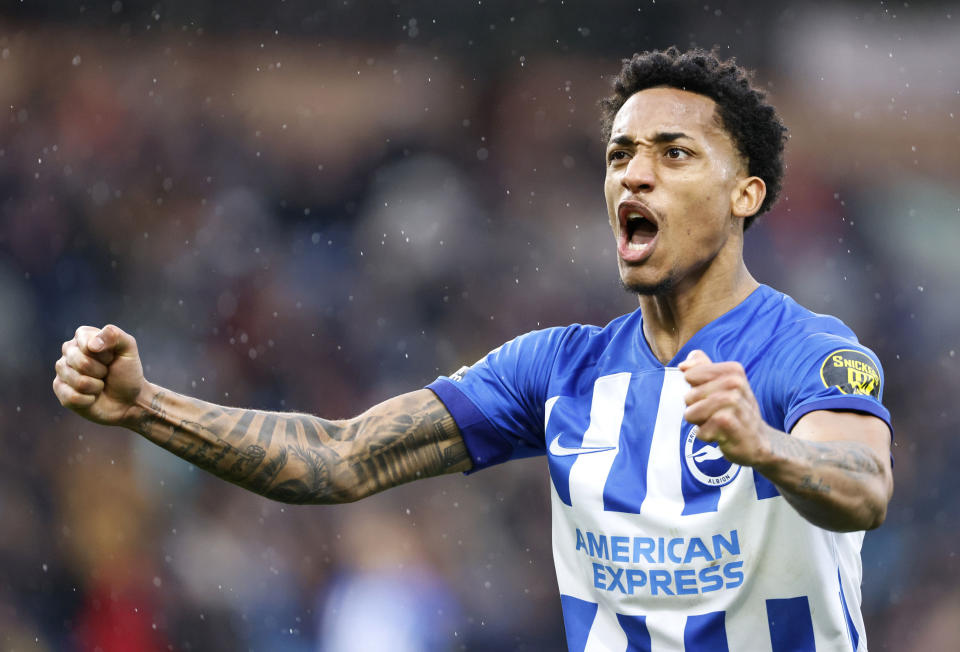 Brighton and Hove Albion's Joao Pedro celebrates his side's first goal of the game, an own goal by Burnley goalkeeper Arijanet Muric, during the English Premier League soccer match between Burnley and Brighton and Hove Albion at the Turf Moor stadium in Burnley, England, Saturday, April 13, 2024. (Richard Sellers/PA via AP)