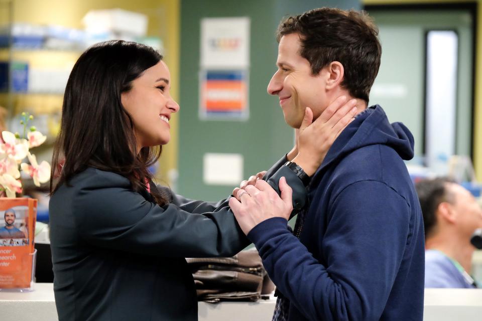 Amy Santiago (Melissa Fumero), left, and Jake Peralta (Andy Samberg) are now married police colleagues on NBC's 'Brooklyn Nine-Nine.'