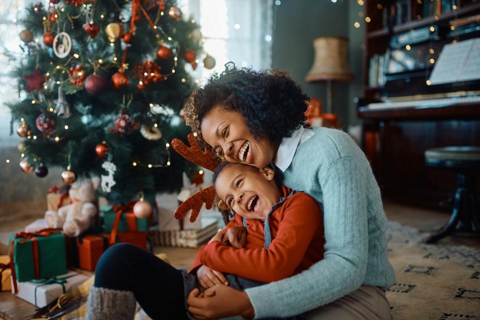 mother and son laughing together on christmas