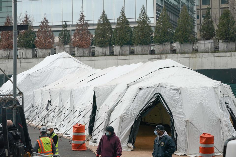 Workers build a makeshift morgue outside of Bellevue Hospital to handle an expected surge in Coronavirus victims on March 25, 2020 in New York.