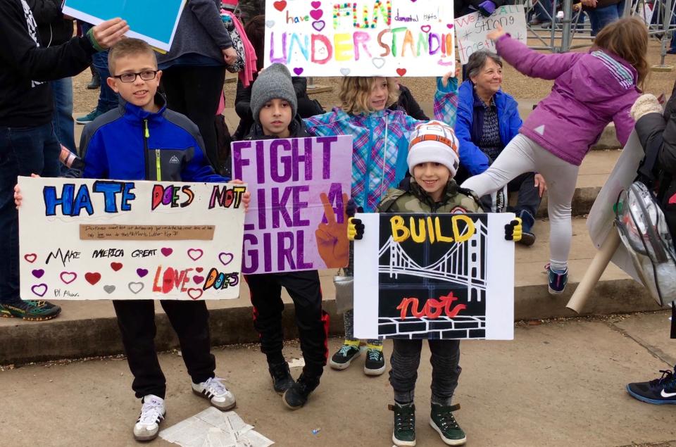 Children hold banners as they stand beside their parents in Washington D.C.&nbsp;