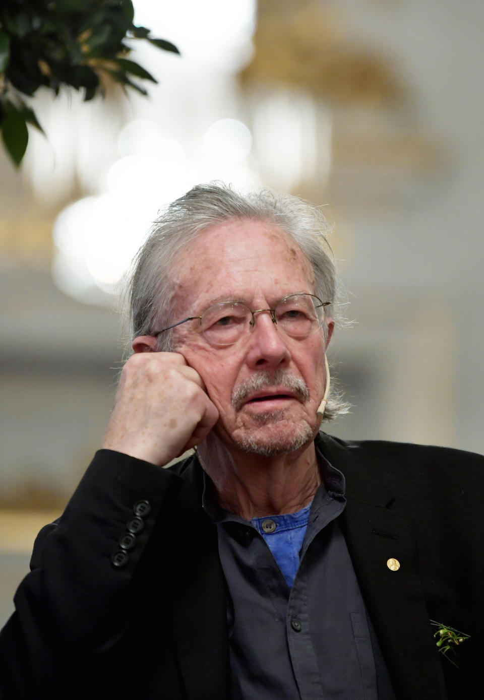 2019 Nobel Prize laureate in literature Peter Handke speaks at a press conference at the Swedish Academy in Stockholm, Sweden, Monday Dec. 6, 2019. (Anders Wiklund/TT via AP)