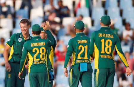 Cricket - South Africa v Sri Lanka - Fifth One Day International cricket match - SuperSport Park Stadium, Centurion, South Africa - 10/2/17 - South Africa cricket players celebrate with captain AB de Villiers afer the dismissal of Sri LankaÕs batsman Kusal Mendis who was caught out by de Villiers. REUTERS/Siphiwe Sibeko