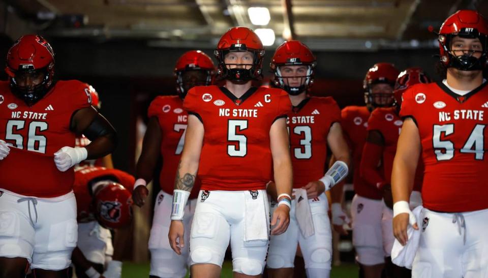 N.C. State quarterback Brennan Armstrong (5) and teammates walk out of the tunnel to warmup before N.C. State’s game against VMI at Carter-Finley Stadium in Raleigh, N.C., Saturday, Sept. 16, 2023.