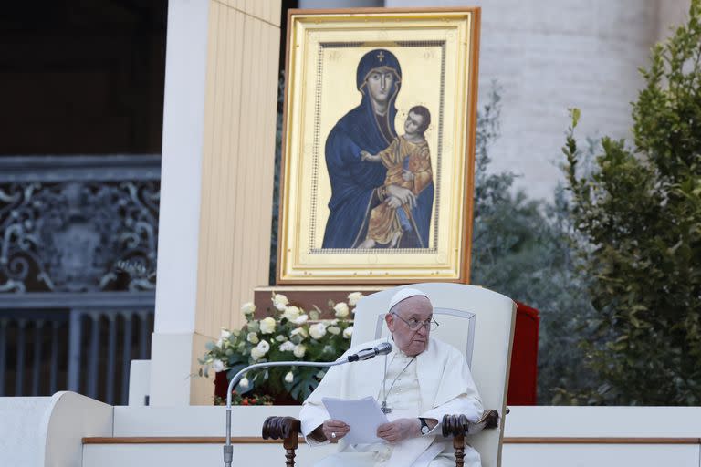 Pope Francis, sitting in front of a replica of the icon 'Maria Salus populi romani'', addresses the participants into 