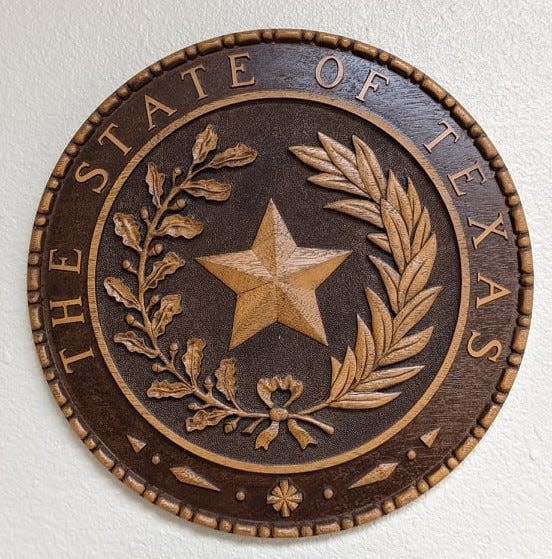 This state of Texas emblem hangs in the Wichita County Courthouse.