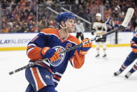 Edmonton Oilers' Connor McDavid (97) celebrates after his 50th goal of the season during second-period NHL hockey game action against the Boston Bruins in Edmonton, Alberta, Monday, Feb. 27, 2023. (Jason Franson/The Canadian Press via AP)