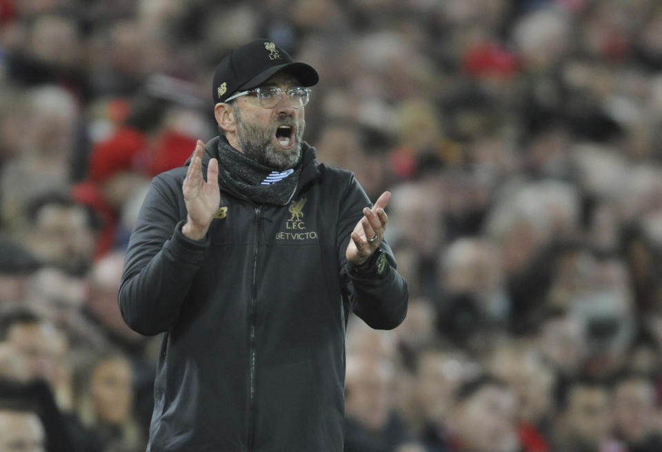 Liverpool's manager Jurgen Klopp gestures to his players during the English Premier League soccer match between Liverpool and Arsenal at Anfield in Liverpool, England, Saturday, Dec. 29, 2018. (AP Photo/Rui Vieira)