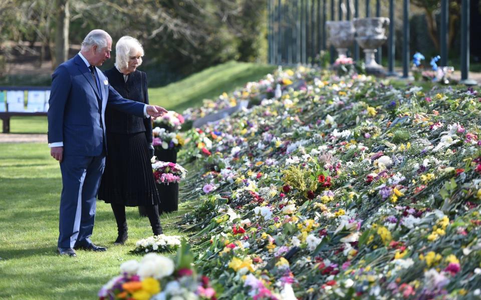 The Prince of Wales and the Duchess of Cornwall visit the gardens of Marlborough House, London, to view the flowers and messages left by members of the public outside Buckingham Palace following the death of the Duke of Edinburgh  - Jeremy Selwyn