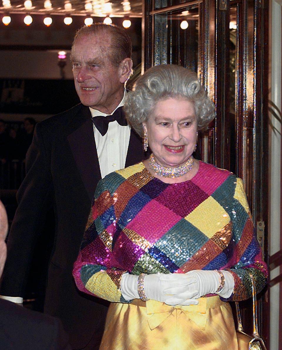 The Queen wearing a multi-coloured sequinned evening gown as she and the Duke of Edinburgh arrived at Birmingham Hippodrome for the 1999 Royal Variety Performance (David Jones/PA) (PA Wire)