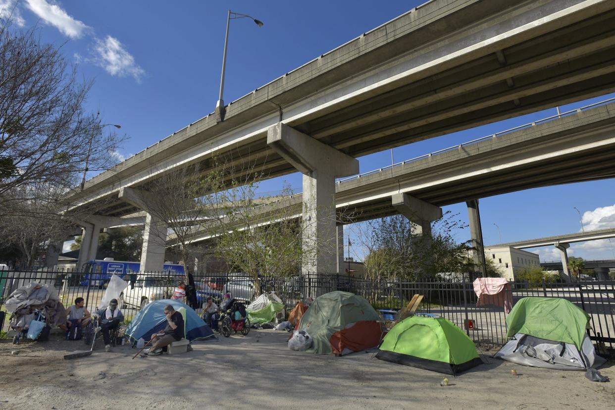 A small homeless encampment is shown in February 2022 just outside the Sulzbacher Center on East Adams Street downtown.