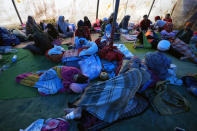 Survivors displaced by Monday's earthquake rest inside a makeshift tent at a temporary shelter in Cianjur, West Java, Indonesia, Friday, Nov. 25, 2022. The quake on Monday killed hundreds of people, many of them children and injured thousands. (AP Photo/Achmad Ibrahim)