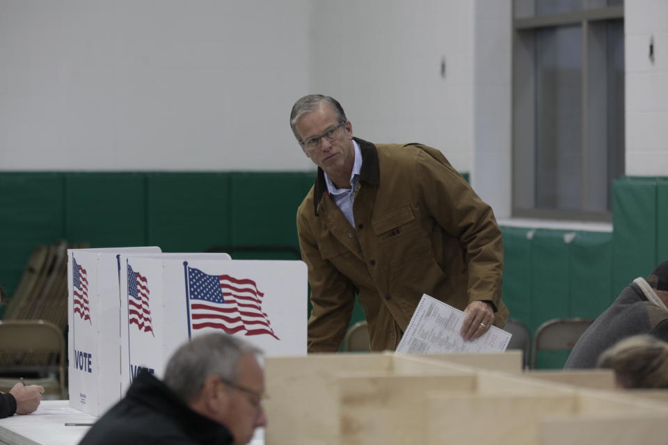 Sen. John Thune, R-S.D., holds a ballot after voting Tuesday, Nov. 8, 2022 in Sioux Falls, S.D. Thune was looking for a decisive reelection win over Democratic challenger Brian Bengs, an Air Force veteran and university professor. (AP Photo/Stephen Groves)