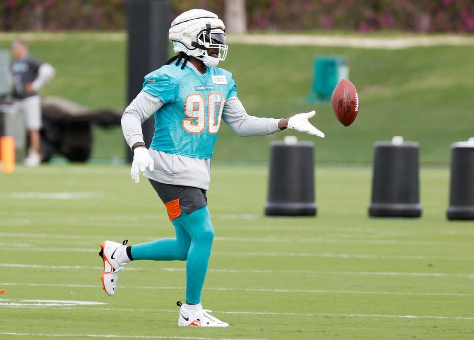 Miami Dolphins linebacker Jason Pierre-Paul tosses the football during practice drills at Baptist Health Training Complex in Miami Gardens on Wednesday, November 29, 2023.