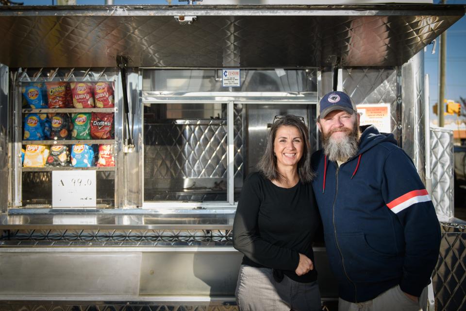 Mike and Jen Adams, owners of Dogslingers.