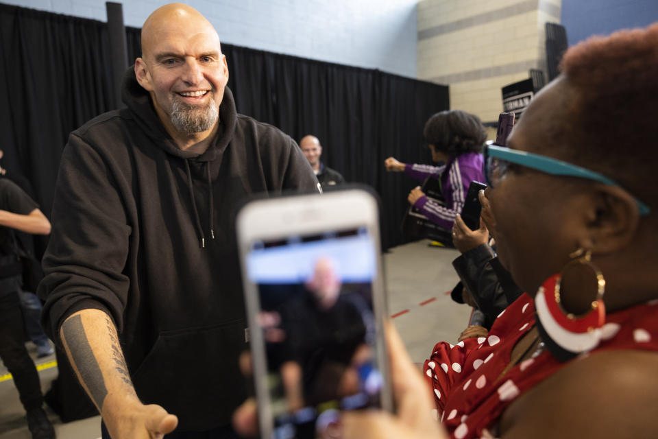 FILE—Pennsylvania Lt. Gov. John Fetterman, left, a Democratic candidate for U.S. Senate, greets supporters as he enters his event in Philadelphia, Saturday, Sept. 24, 2022. Black voters are at the center of an increasingly competitive battle in a race that could tilt control of the Senate between Fetterman and Republican Mehmet Oz, as Democrats try to harness outrage over the Supreme Court's abortion decision and Republicans tap the national playbook to focus on rising crime in cities. (AP Photo/Ryan Collerd, File)