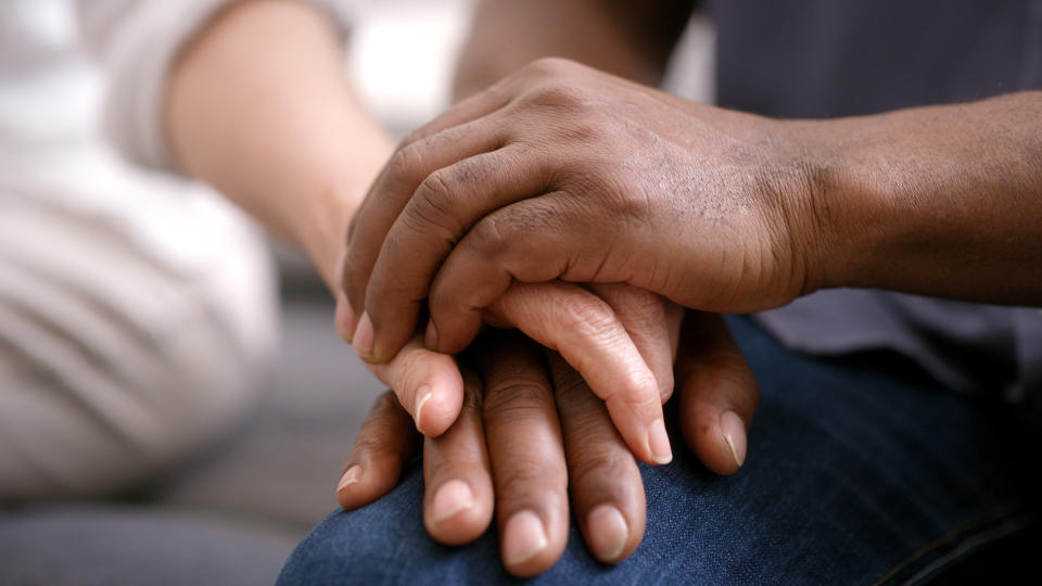 two people holding hands