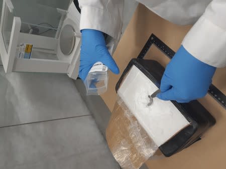 Dutch National Police shows methamphetamine, part of a seizure of 2.5 tonnes in an office building in Rotterdam