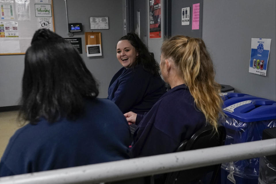 Heather Jarvis waits with others for transportation after being processed for release at the Ohio Reformatory for Women, in Marysville, Ohio, Wednesday, Oct. 25, 2023. Jarvis is part of the fastest-growing prison population in the country, one of more than 190,000 women held in some form of confinement in the United States as of this year. Their numbers grew by more than 500% between 1980 and 2021. (AP Photo/Carolyn Kaster)