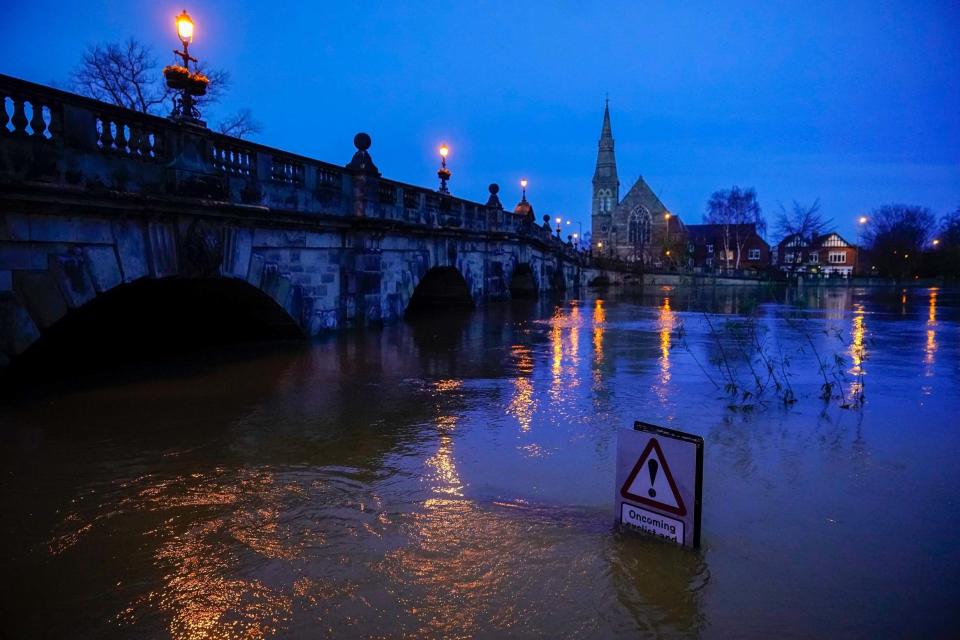 A street sign is part submerged by floodwater after the River Severn burst its banks (Getty Images)