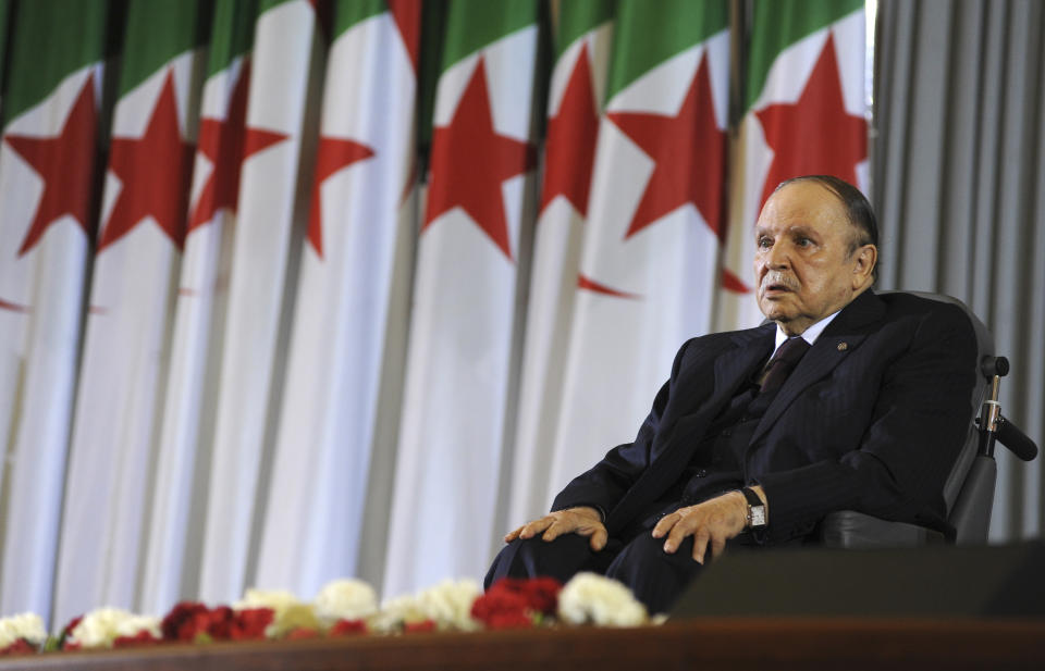 FILE - In this April 28, 2014 file photo, Algerian President Abdelaziz Bouteflika sits on a wheelchair after taking oath as President, in Algiers. Embattled Algerian President Abdelaziz Bouteflika says he will step down before his fourth term ends on April 28. In a short statement issued on Monday April 1, 2019, the president's office said Bouteflika would take "important steps to ensure the continuity of the functioning of state institutions" during a transition period following his departure from the post he's held since 1999. (AP Photo/Sidali Djarboub, File)