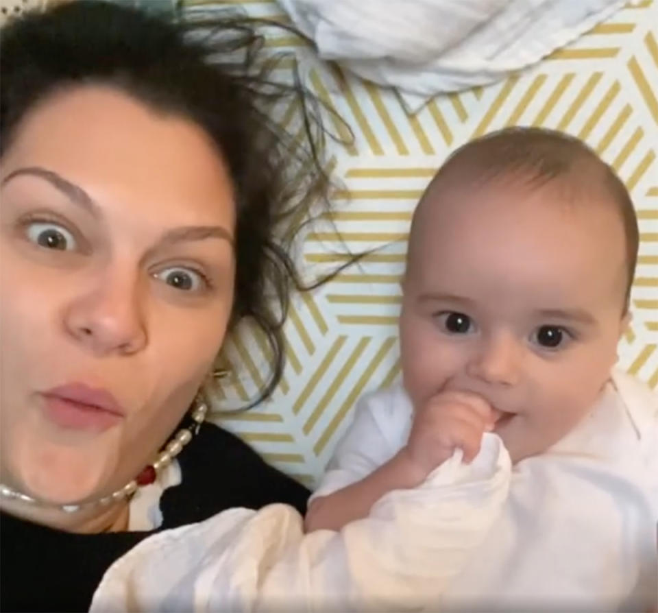 A selfie of Jessie J lying on a mat with a young baby boy. Photo: Instagram/jessiej.