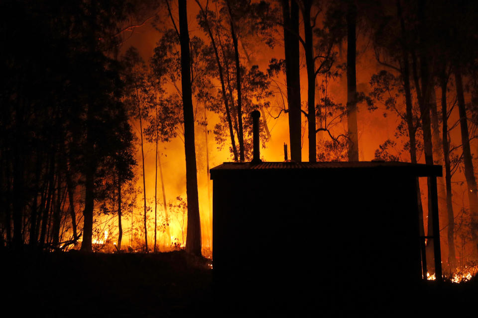 Bushfires are seen between the towns of Orbost and Lakes Entrance in east Gippsland on Jan. 02, 2020 in Australia. (Photo by Darrian Traynor/Getty Images)