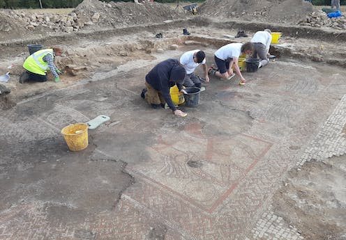 <span class="caption">Archaeology students and ULAS staff from University of Leicester carefully clean the fully exposed Trojan War mosaic. </span> <span class="attribution"><span class="source">© ULAS</span>, <span class="license">Author provided</span></span>