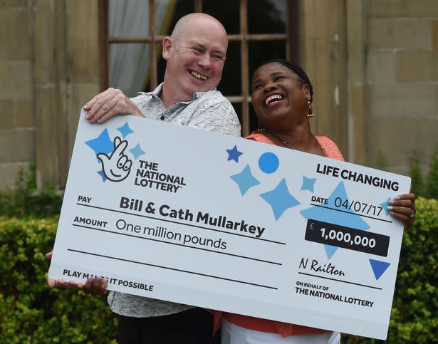 The couple pictured with their lottery cheque in 2015. (Reach)