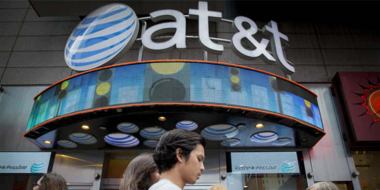 People walk past the AT&T store in New York's Times Square. REUTERS/Brendan McDermid