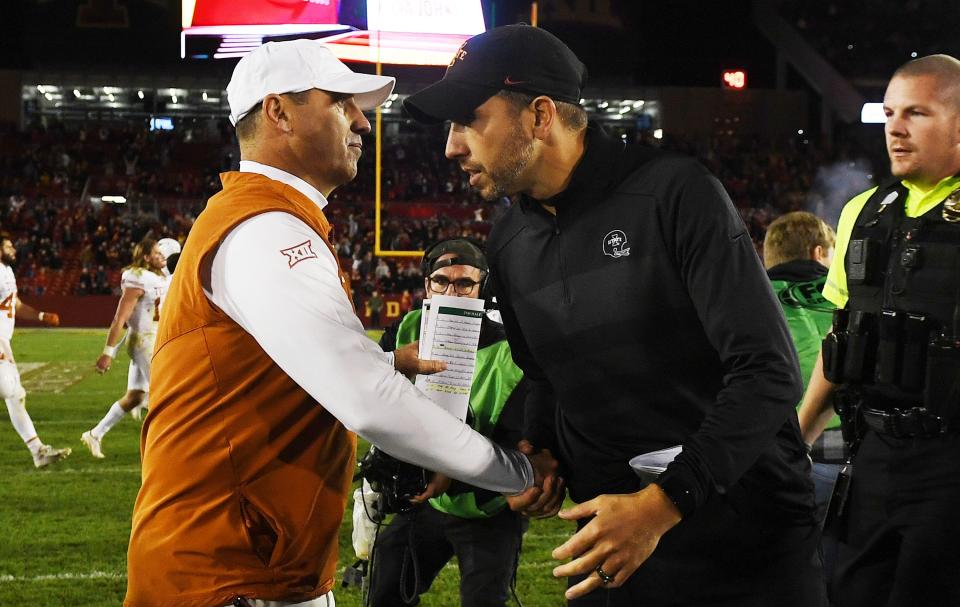 Iowa State Cyclones head coach Matt Campbell gets a congratulation from Texas Longhorns head coach Steve Sarkisian after winning 30-7 at Jack Trice Stadium in 2021. The two coaches will face off again Saturday night in Ames.