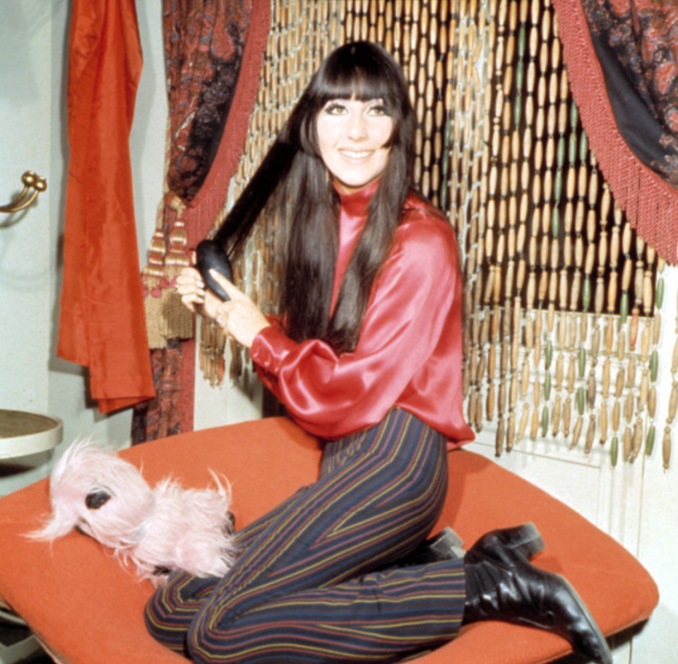 <p>Check out those bangs! And how about that fabulous satin shirt. <i>[Photo: Rex]</i></p>