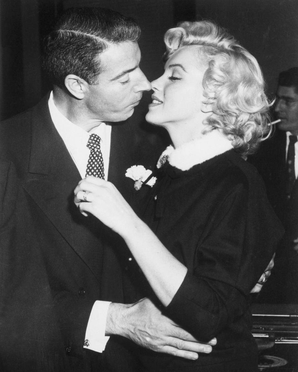 <p>After a simple courthouse ceremony, Joe DiMaggio sealed his nuptials to Marilyn Monroe with a diamond eternity band. The engagement ring, <a href="https://theadventurine.com/bridal/engagement-rings/the-mystery-of-marilyn-monroes-eternity-band-from-joe-dimaggio/" rel="nofollow noopener" target="_blank" data-ylk="slk:set in platinum;elm:context_link;itc:0;sec:content-canvas" class="link ">set in platinum</a> and fitted with 36 baguette cut diamonds, was a huge trendsetter. </p>