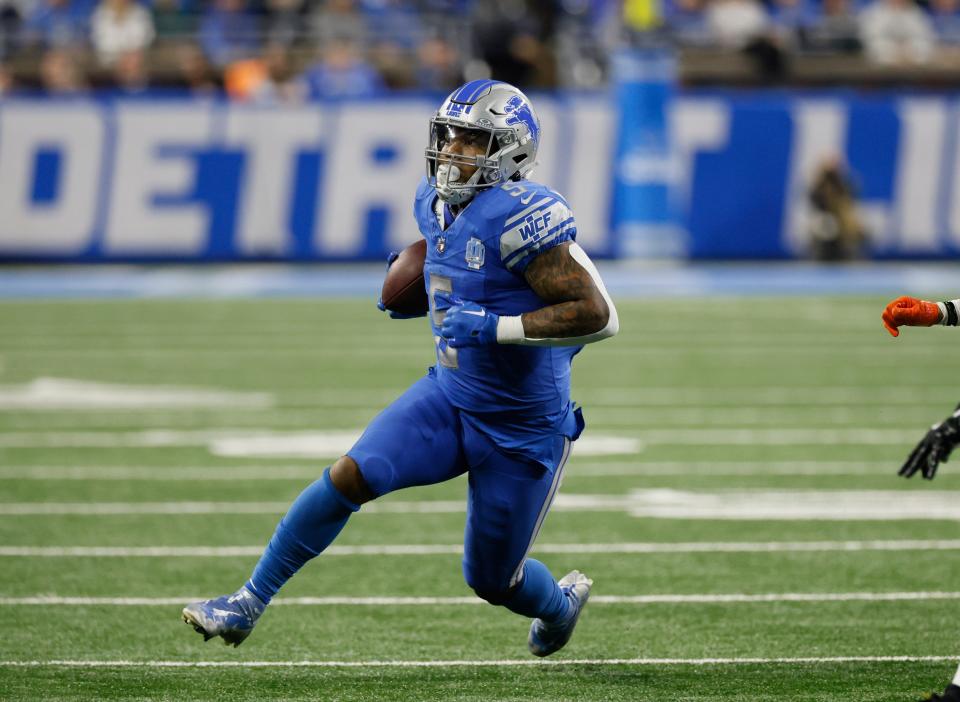 Detroit Lions running back David Montgomery (5) rushes against the Denver Broncos during the first half of an NFL football game Saturday, Dec. 16, 2023, in Detroit. (AP Photo/Duane Burleson)