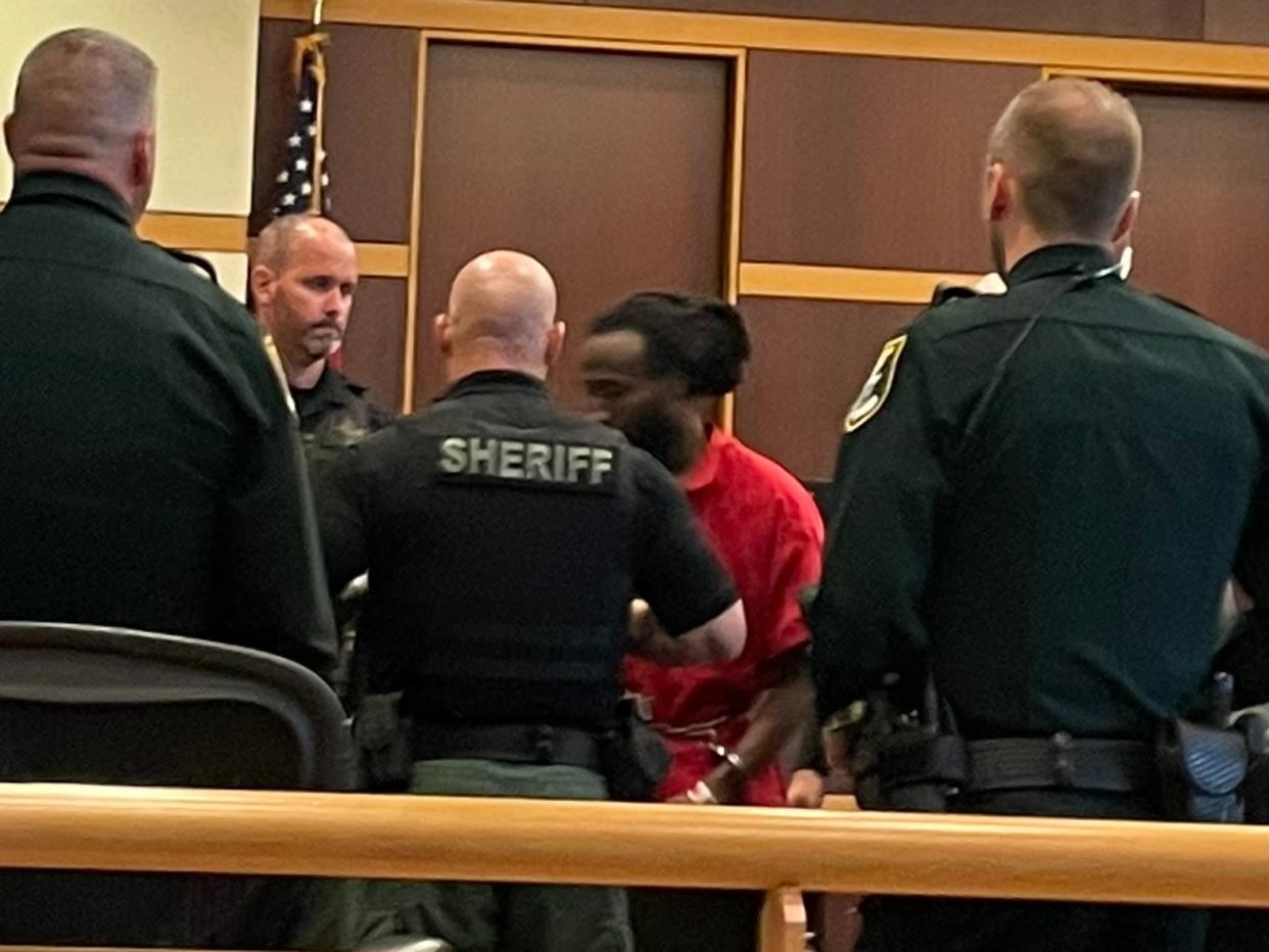 Wisner Desmaret, 33, is escorted out of the courtroom after Judge Robert Branning denied a change of venue motion for the man accused in the 2018 fatal shooting of Fort Myers Police Officer Adam Jobbers-Miller.