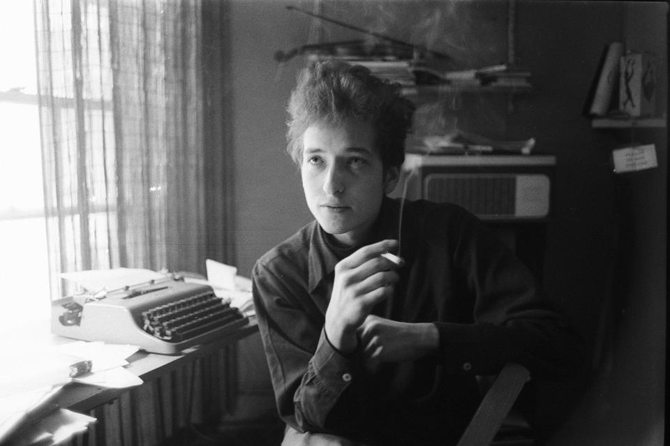 Bob Dylan smoking at typewriter