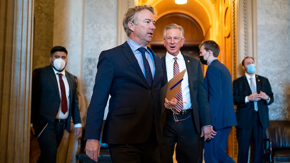 Sens. Rand Paul (R-Ky.) and Tommy Tuberville (R-Ala.) leave the Senate Chamber following a nomination vote for Robert Califf to be Commissioner of the Food and Drug Administration on Tuesday, February 15, 2022.