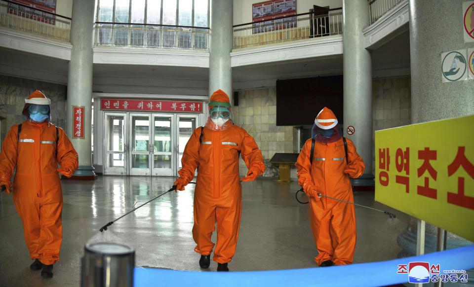 In this photo provided by the North Korean government, station staff disinfect the floor of Pyongyang station to curb the spread of coronavirus infection, in Pyongyang, North Korea Tuesday, May 17, 2022. Independent journalists were not given access to cover the event depicted in this image distributed by the North Korean government. The content of this image is as provided and cannot be independently verified. Korean language watermark on image as provided by source reads: "KCNA" which is the abbreviation for Korean Central News Agency. (Korean Central News Agency/Korea News Service via AP)