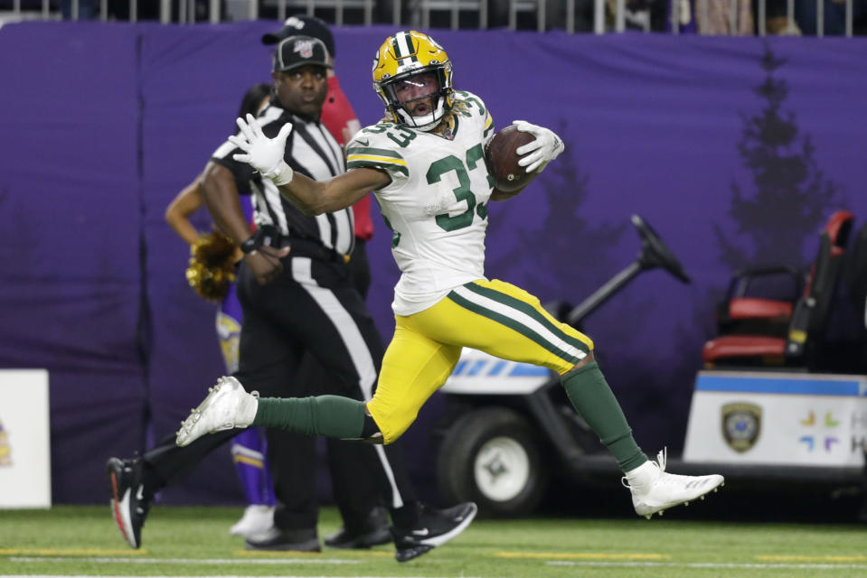 Green Bay Packers running back Aaron Jones runs for a 56-yard touchdown during the second half of the team's NFL football game against the Minnesota Vikings, Monday, Dec. 23, 2019, in Minneapolis. (AP Photo/Andy Clayton-King)