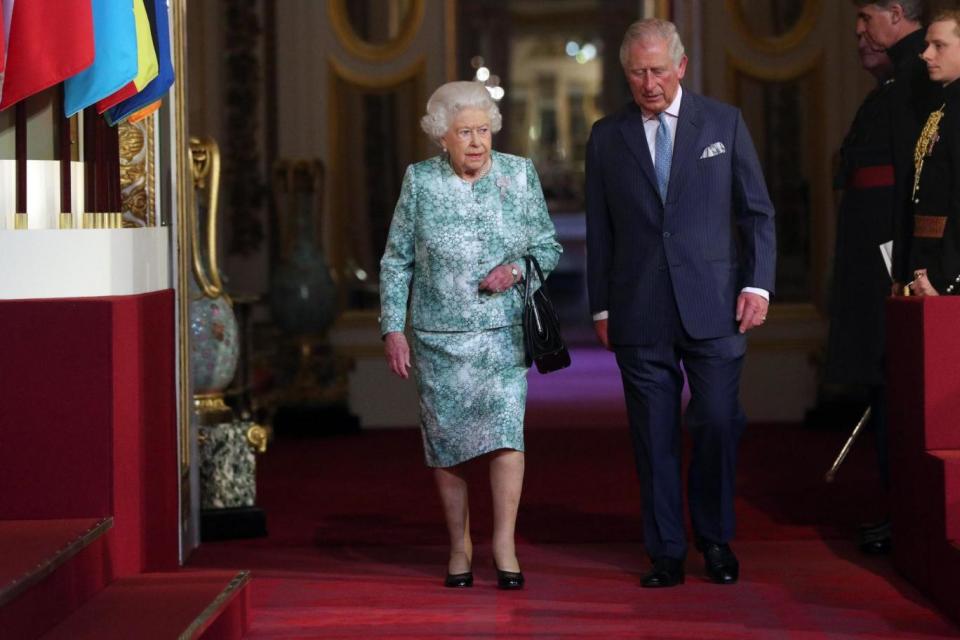 Queen Elizabeth II and the Prince of Wales arrive for the formal opening of the Commonwealth Heads of Government Meeting (PA)