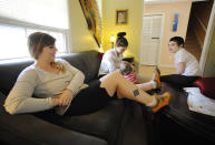 <p>Former skinhead Shannon Martinez, left, talks with some of her children in their home in Athens, Ga., Jan. 11, 2017. A member of the racist group starting in her teen years, Martinez quit decades ago and is now worried about a possible rise in extremism in the United States. (Photo: Jay Reeves/AP) </p>